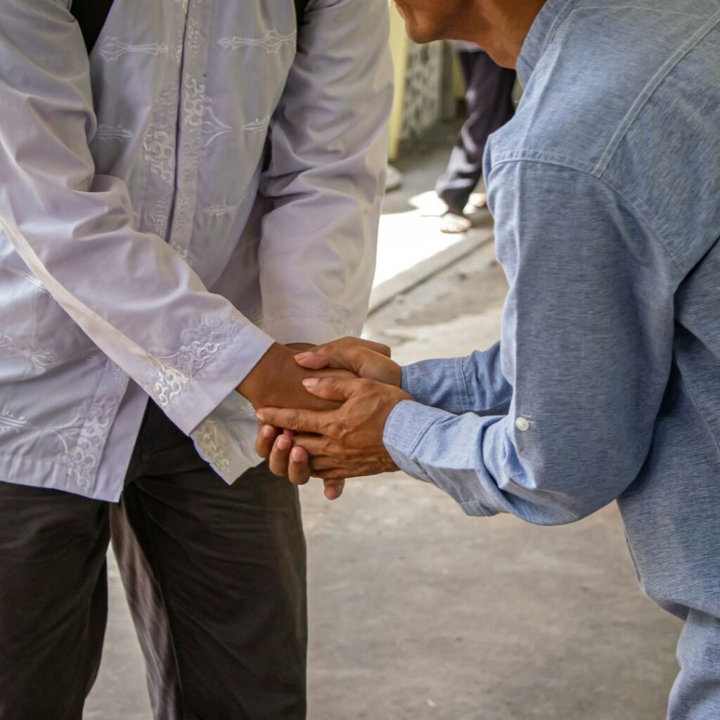 Two people shaking hands, as if forming a home inspectors network.