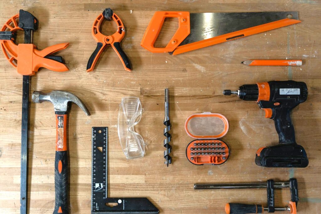 An assortment of tools one might use to perform home inspection repairs. Can home inspectors do repairs? We explain why they shouldn’t.