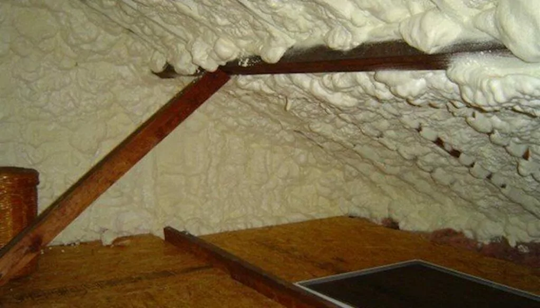 Spray foam insulation observed in an attic.